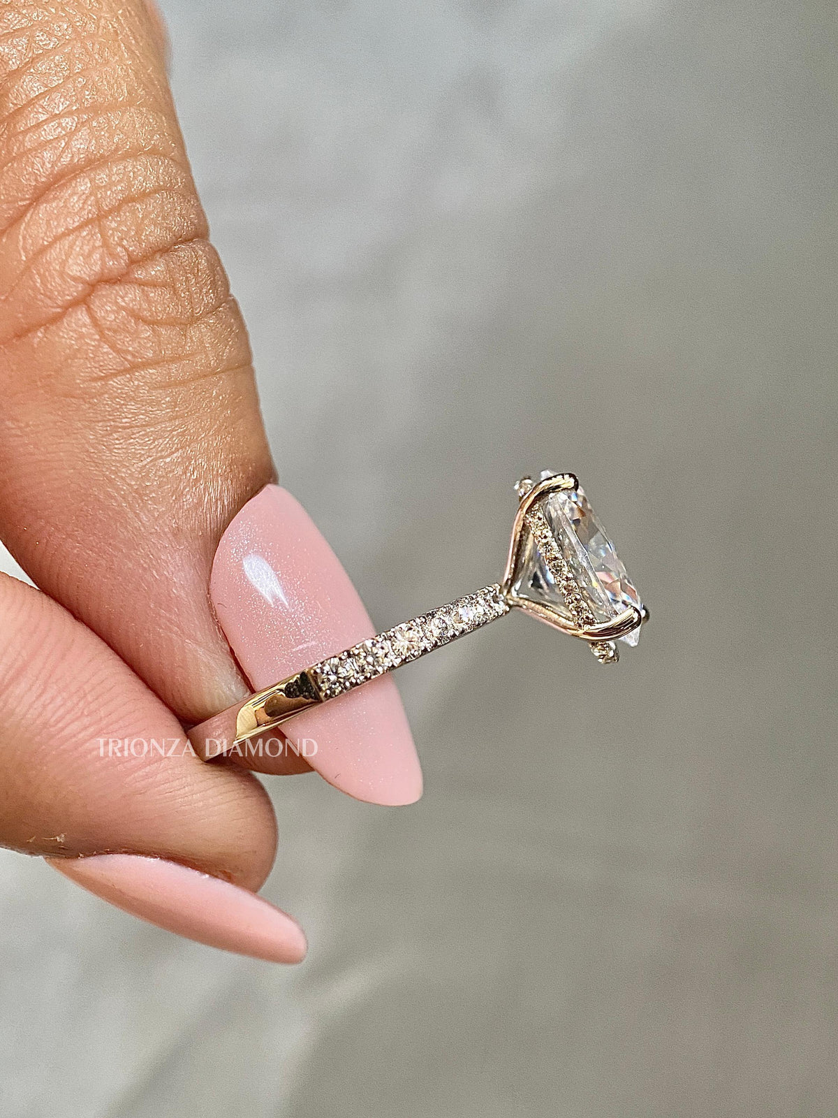 Close-up of the 3 CT oval cut diamond showcasing its F color and VVS2 clarity