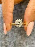 Yellow gold engagement ring featuring a round cut conflict free lab grown diamond