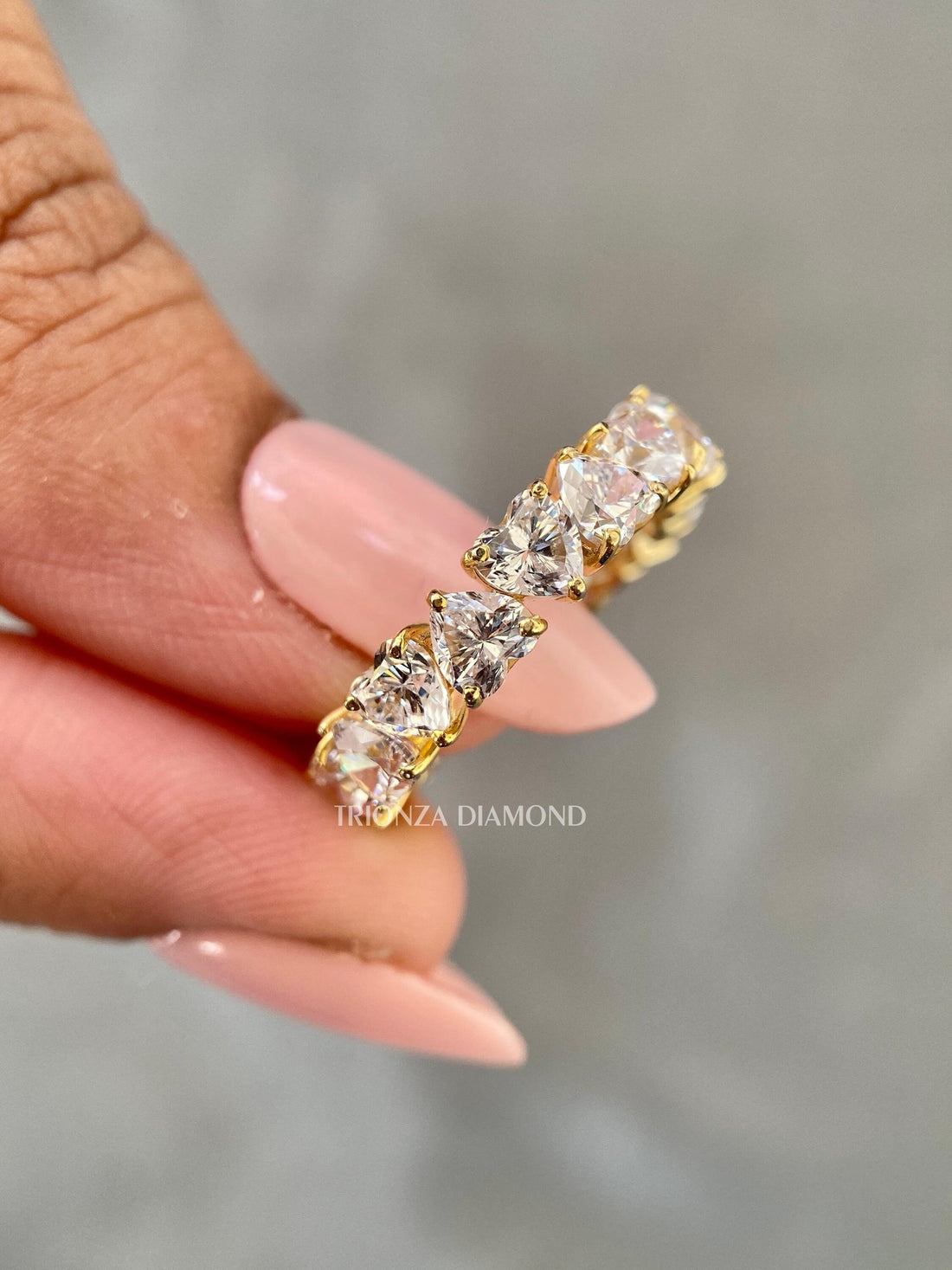 Heart shaped lab grown diamond engagement ring displayed to highlight its stackable band design
