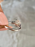 Woman wearing the cushion cut diamond engagement ring, close-up view on her hand