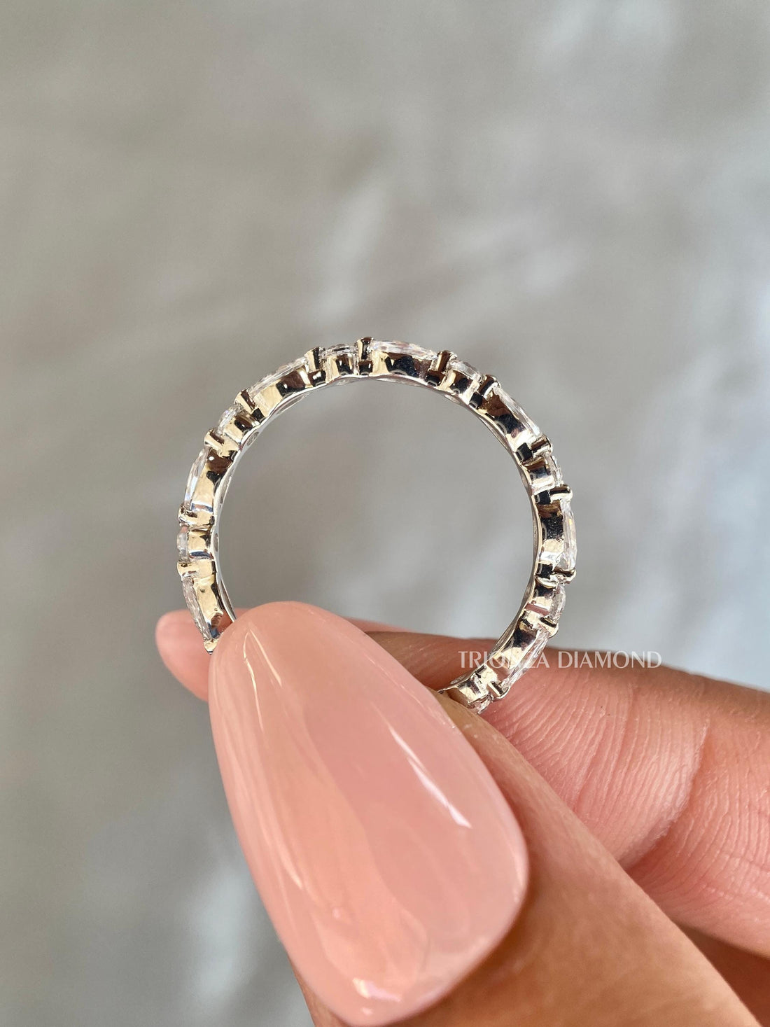 Alternating marquise and round cut lab grown diamond wedding band shown in a full eternity design