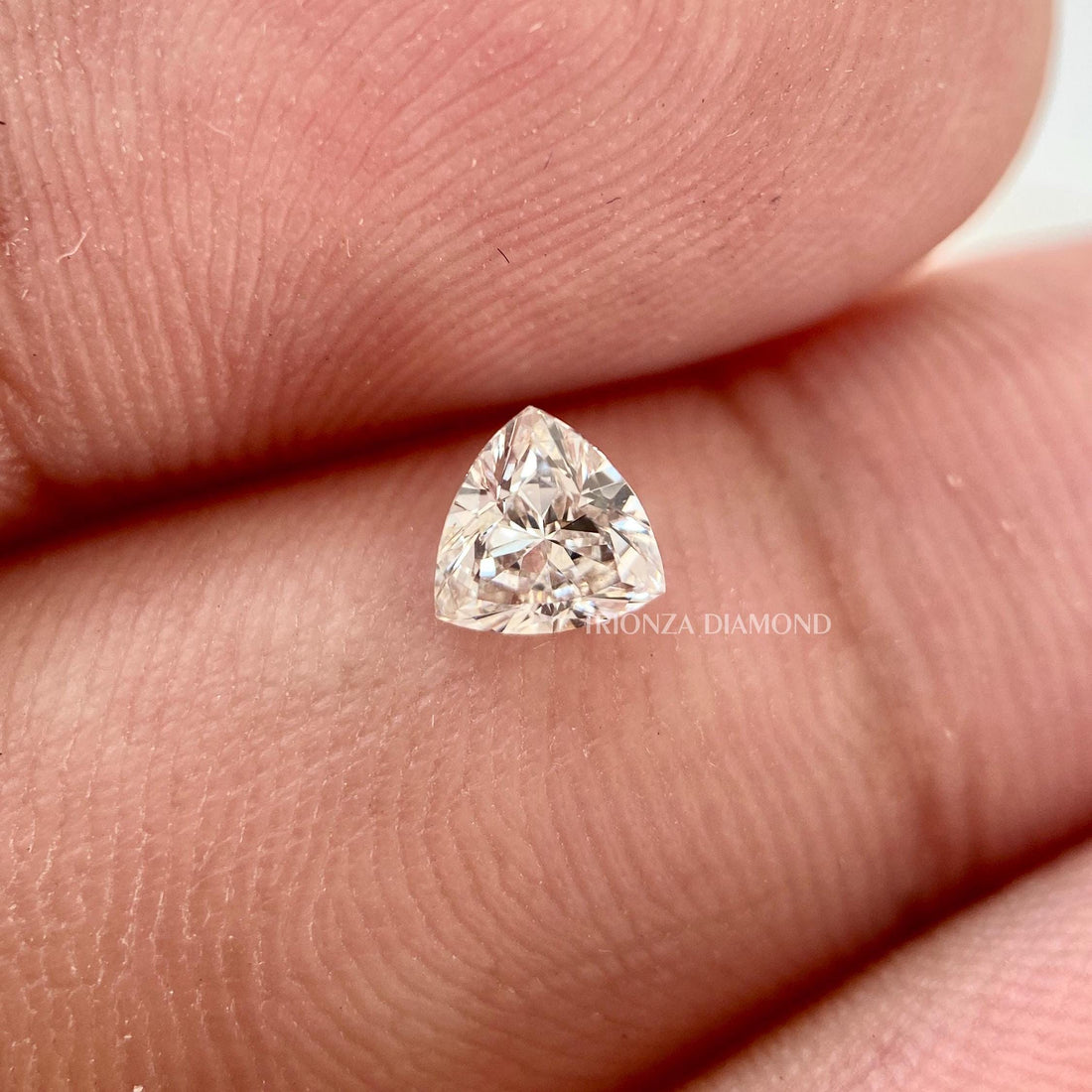Trillion cut lab grown diamond pair displayed together showing matching EF color and VS clarity