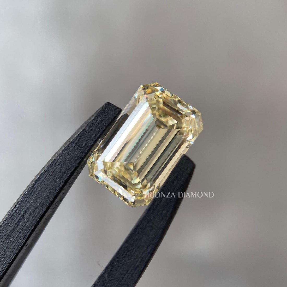 Emerald cut light yellow lab grown diamond showcasing its 1.02 CT fancy color brilliance