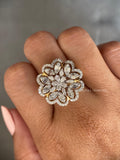 Woman wearing the floral marquise and pear diamond ring on her hand