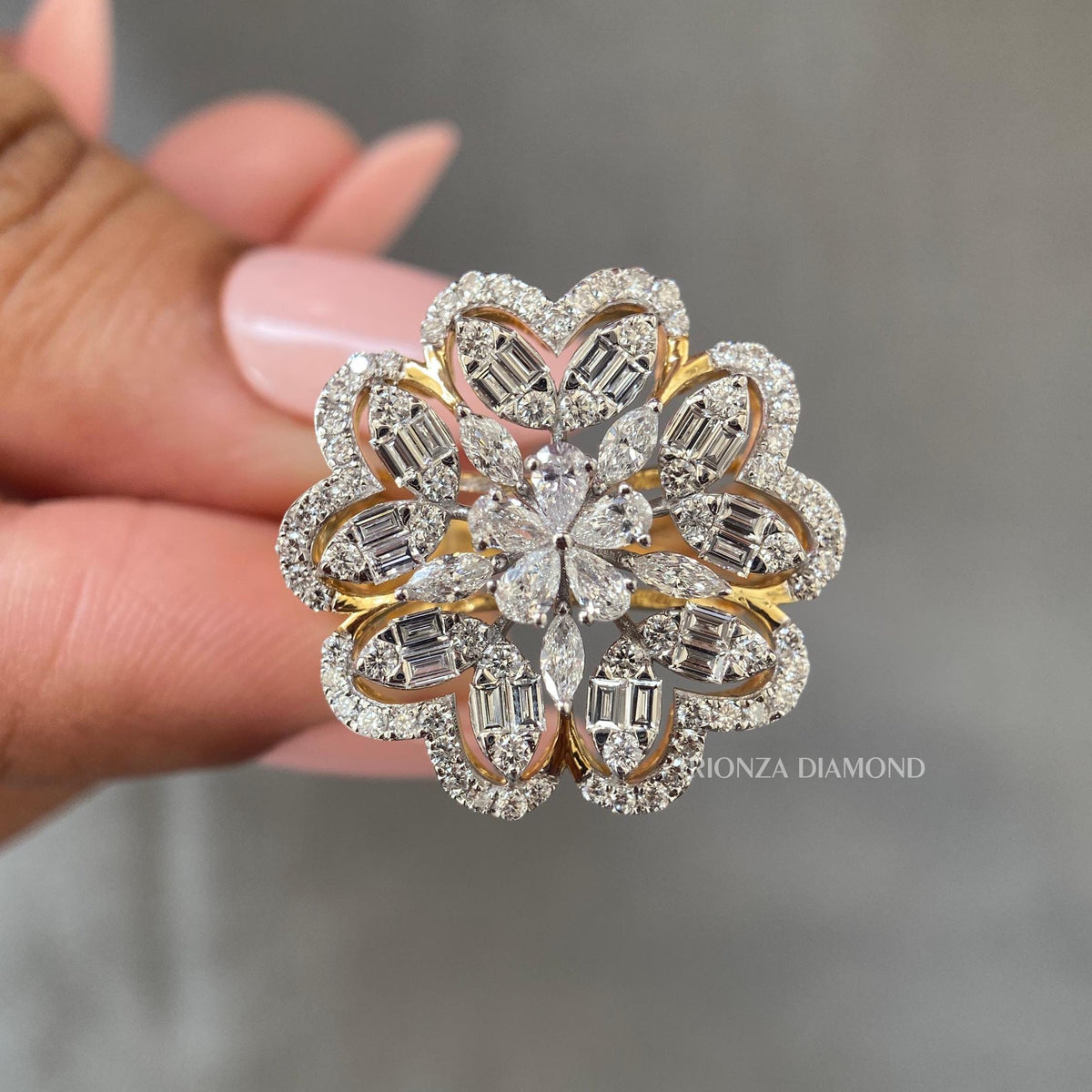 Close-up of the pear and marquise cut diamonds set in a floral inspired design