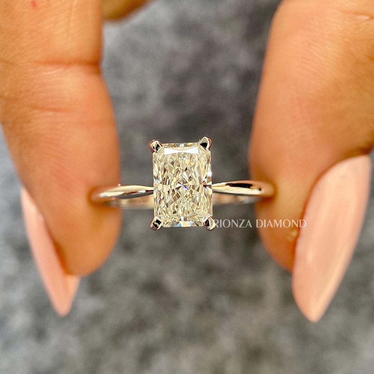 TrionzaDiamond engagement ring designed to highlight the brilliance of the radiant cut center stone