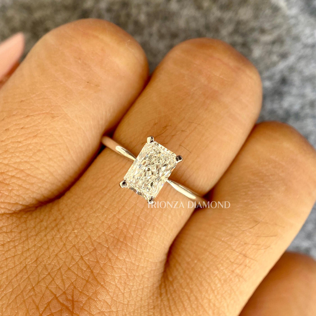Side view of the solitaire ring showing the 1.70mm bandwidth and thickness in 14k white gold