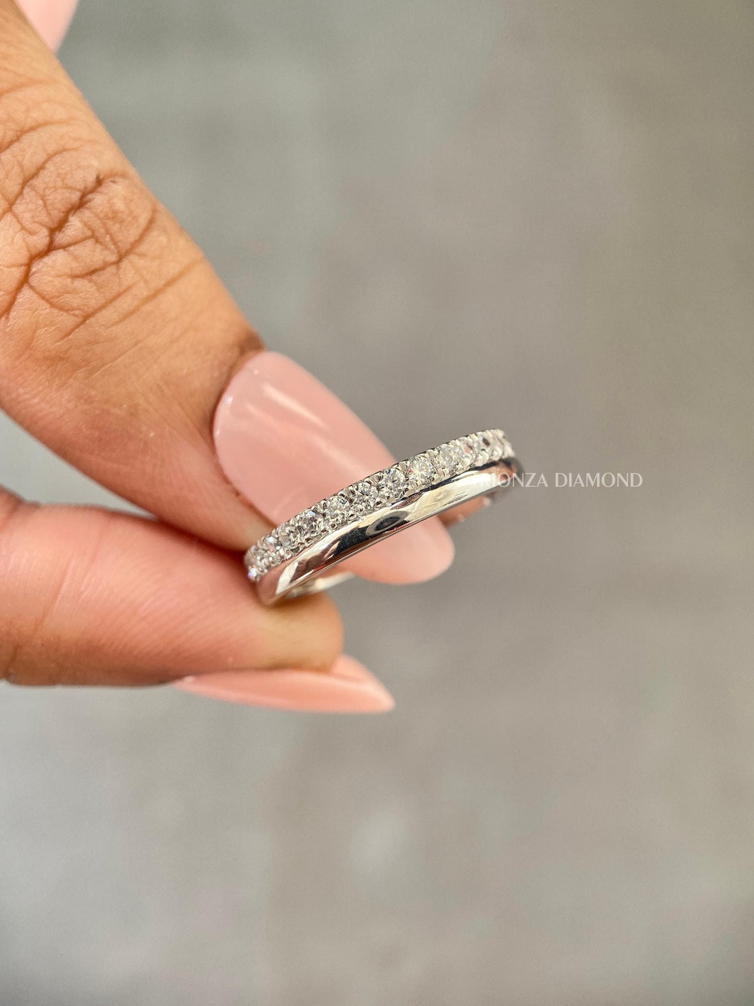 Double row lab grown diamond wedding band featuring round cut micro pave diamonds