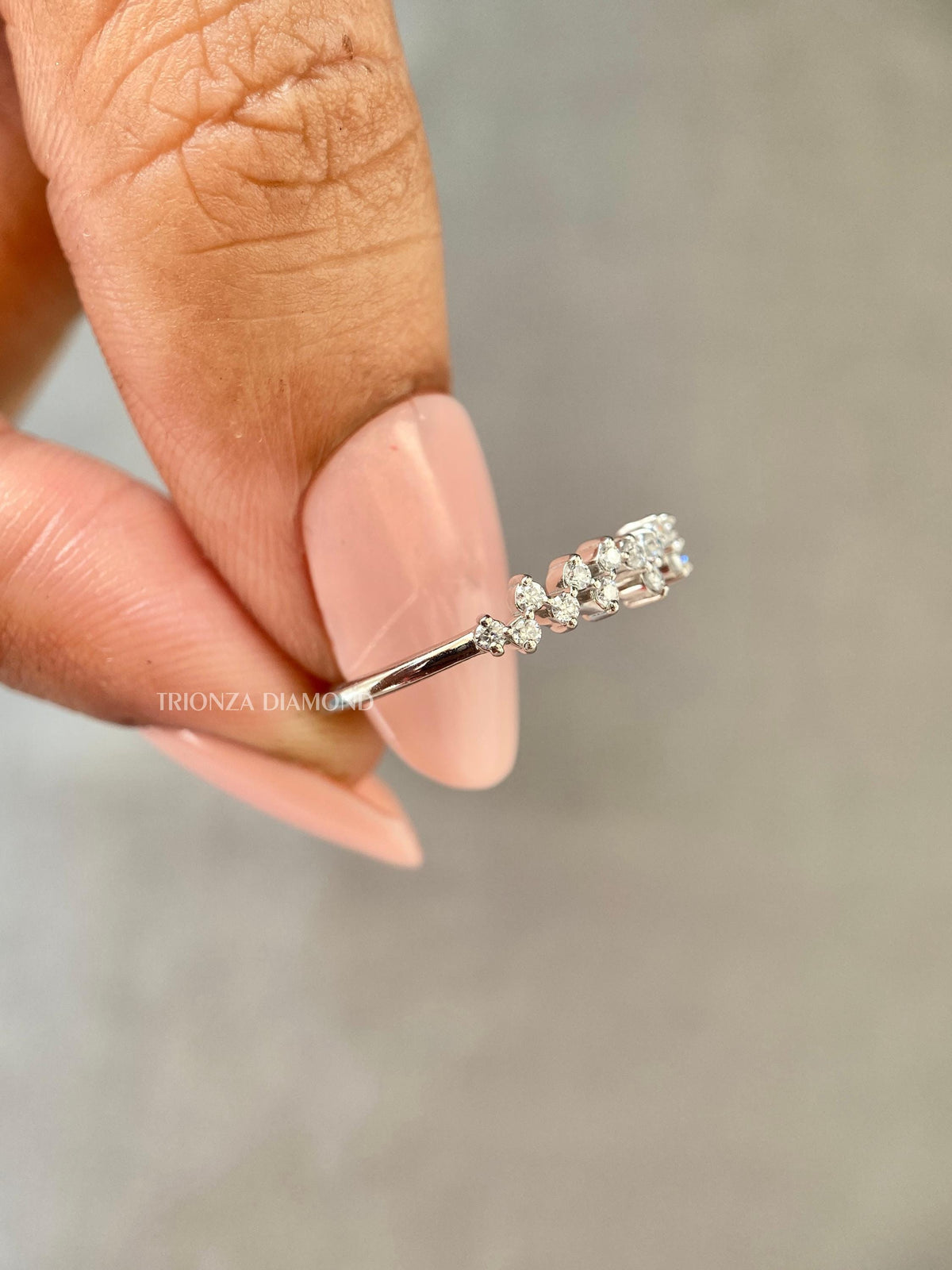 Close-up of the 1.20mm round diamonds set along the stackable wedding band