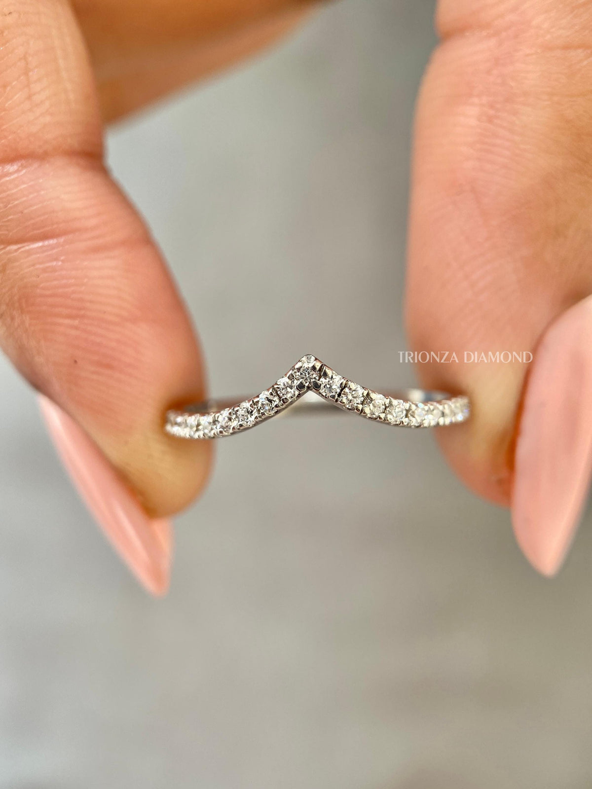 Round lab grown diamond curved chevron wedding band designed for stackable everyday elegance