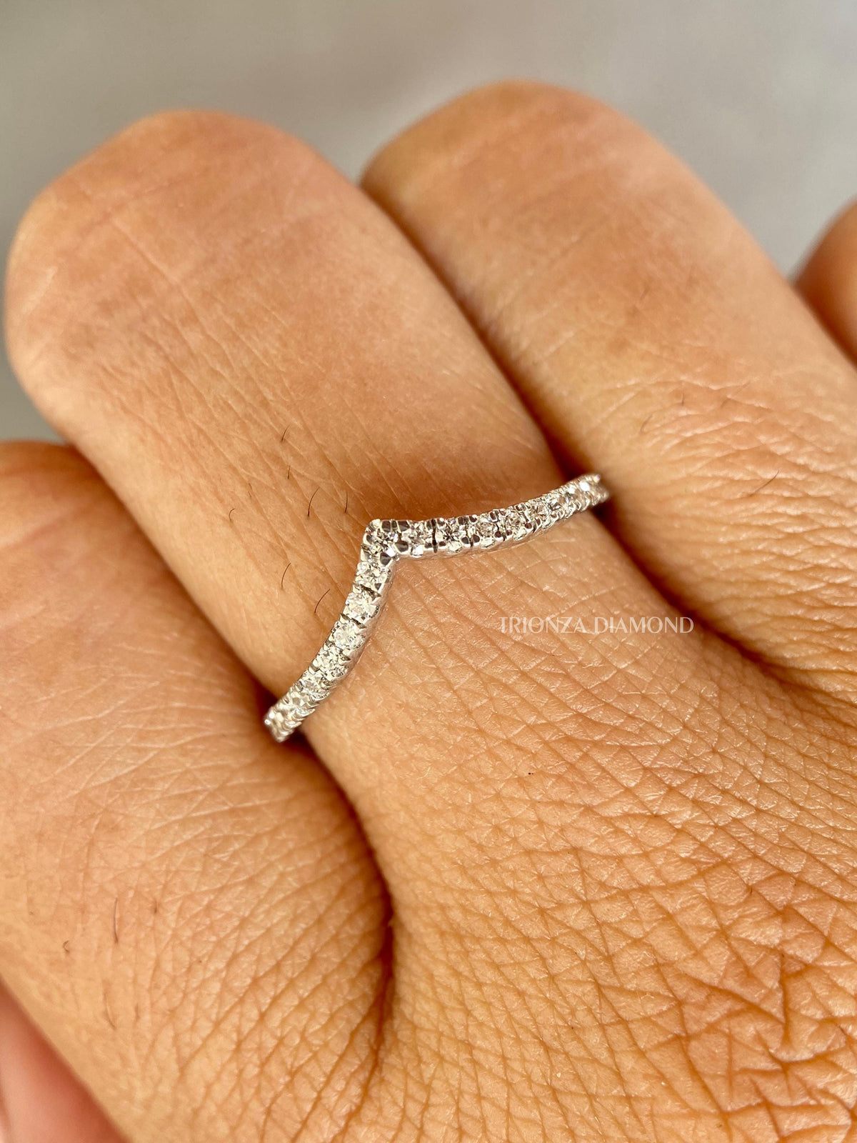 Close-up of the 1.40 MM round cut lab diamonds set along the curved chevron shape