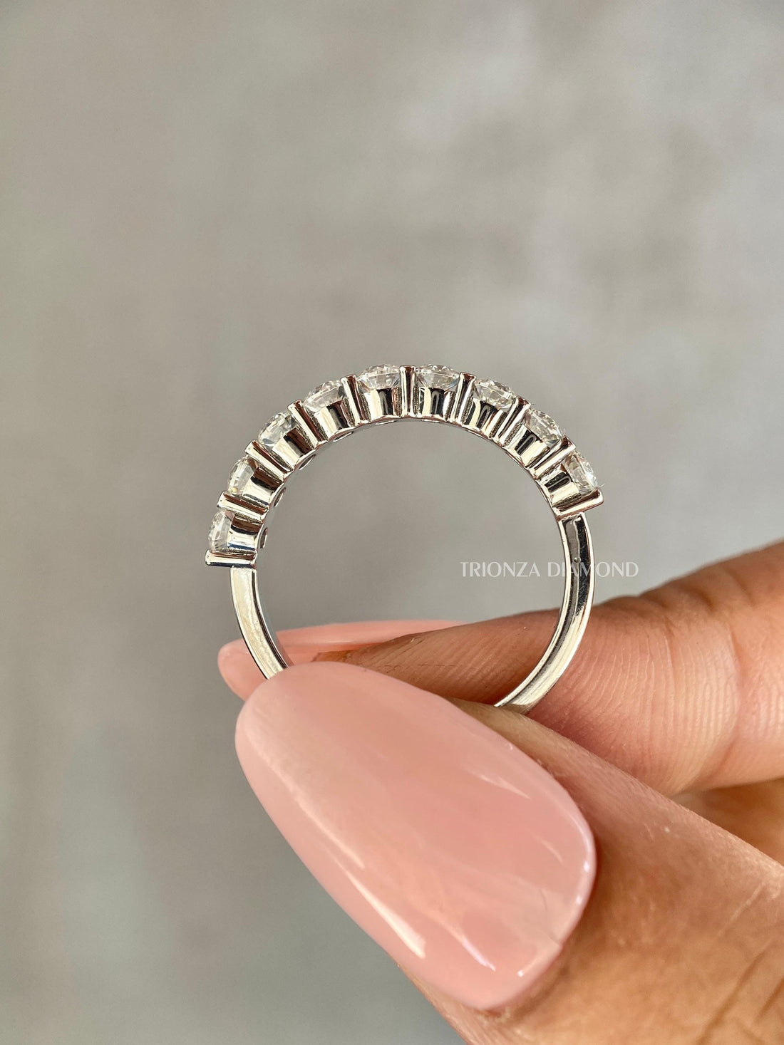Half eternity lab grown diamond wedding band featuring round cut stones in a floating bubble design