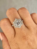 Woman wearing the round diamond halo engagement ring, close-up on her hand