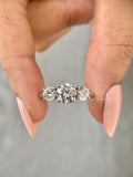 3 stone round lab diamond anniversary band in yellow gold with a 1.50 CT center stone
