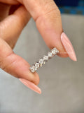 Full eternity band showcasing D/E color and VVS/VS clarity round cut diamonds