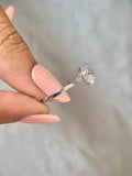 Woman wearing the 2 CT round diamond ring for an elegant everyday look