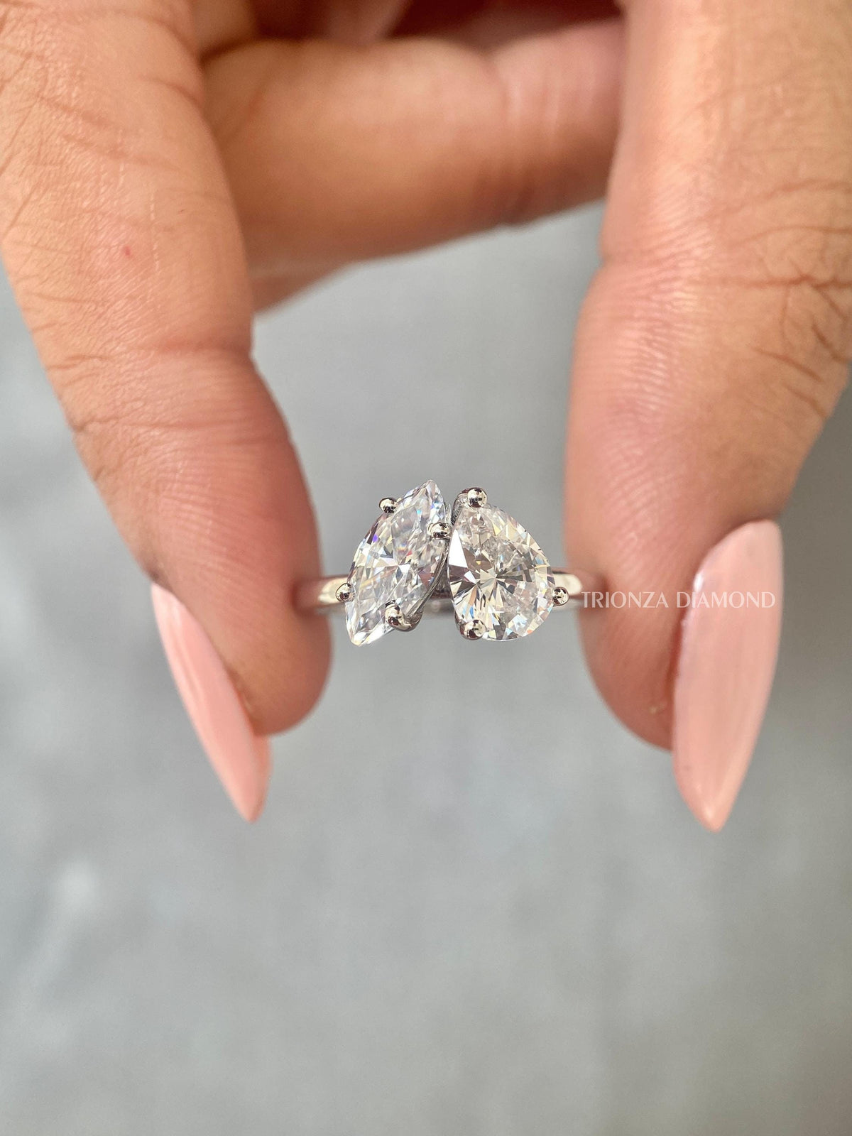 Toi et moi ring featuring a marquise cut and pear cut lab grown diamond set side by side