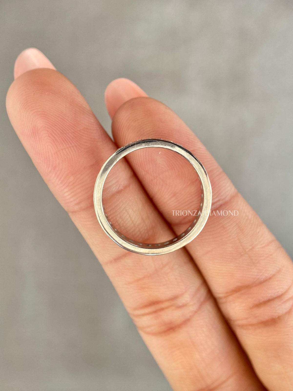 Close-up of the 1.80mm round diamonds set securely along the 14K gold band
