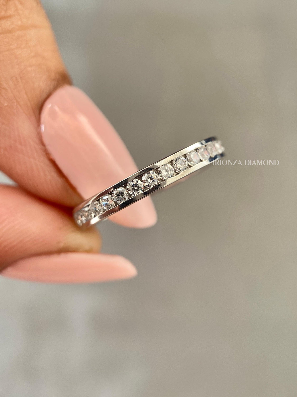 Round cut lab grown diamond channel set stackable band crafted in 14K gold