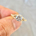 Vintage floral engagement ring featuring D color VVS2 lab grown diamond and accent stones