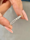 Diamond wedding band for her displayed to highlight the trellis setting details