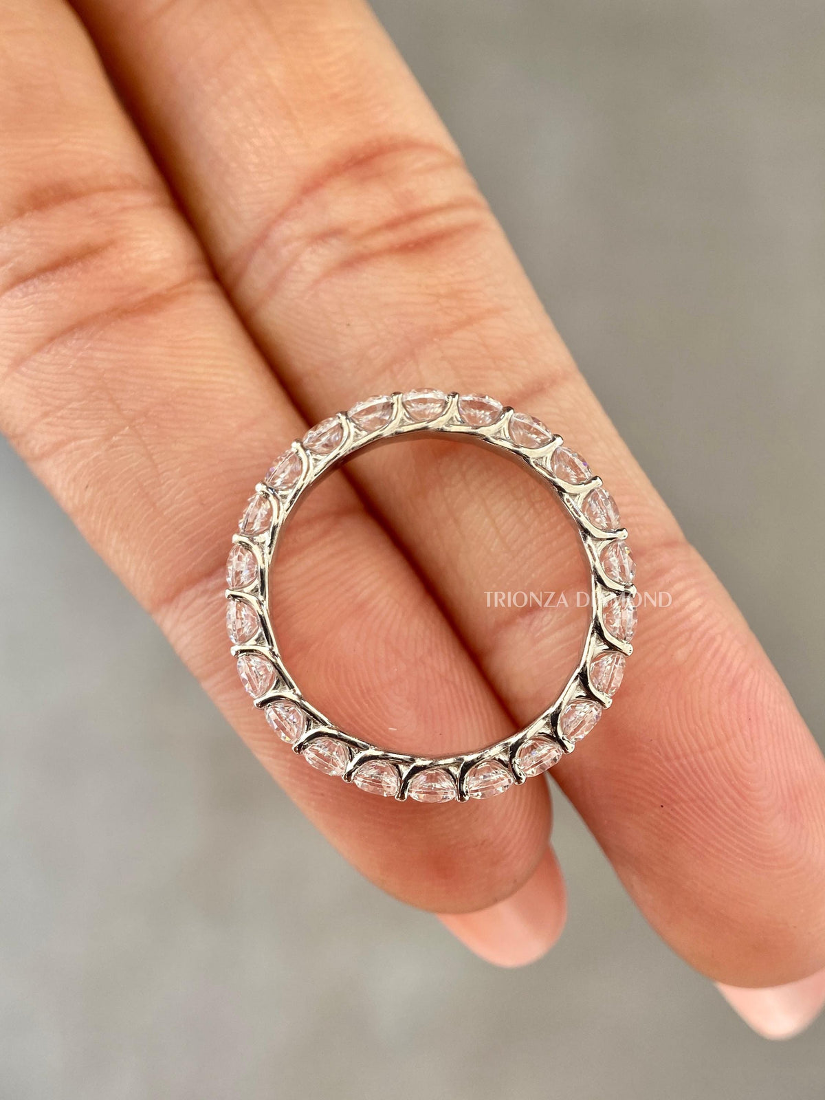 Stackable eternity band shown alongside a matching wedding band for pairing options