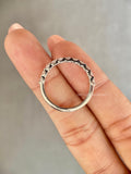 Woman wearing the stackable lab created diamond wedding band on her hand