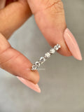 Round diamond eternity band featuring seven 2.5 mm lab grown diamonds set in 950 platinum