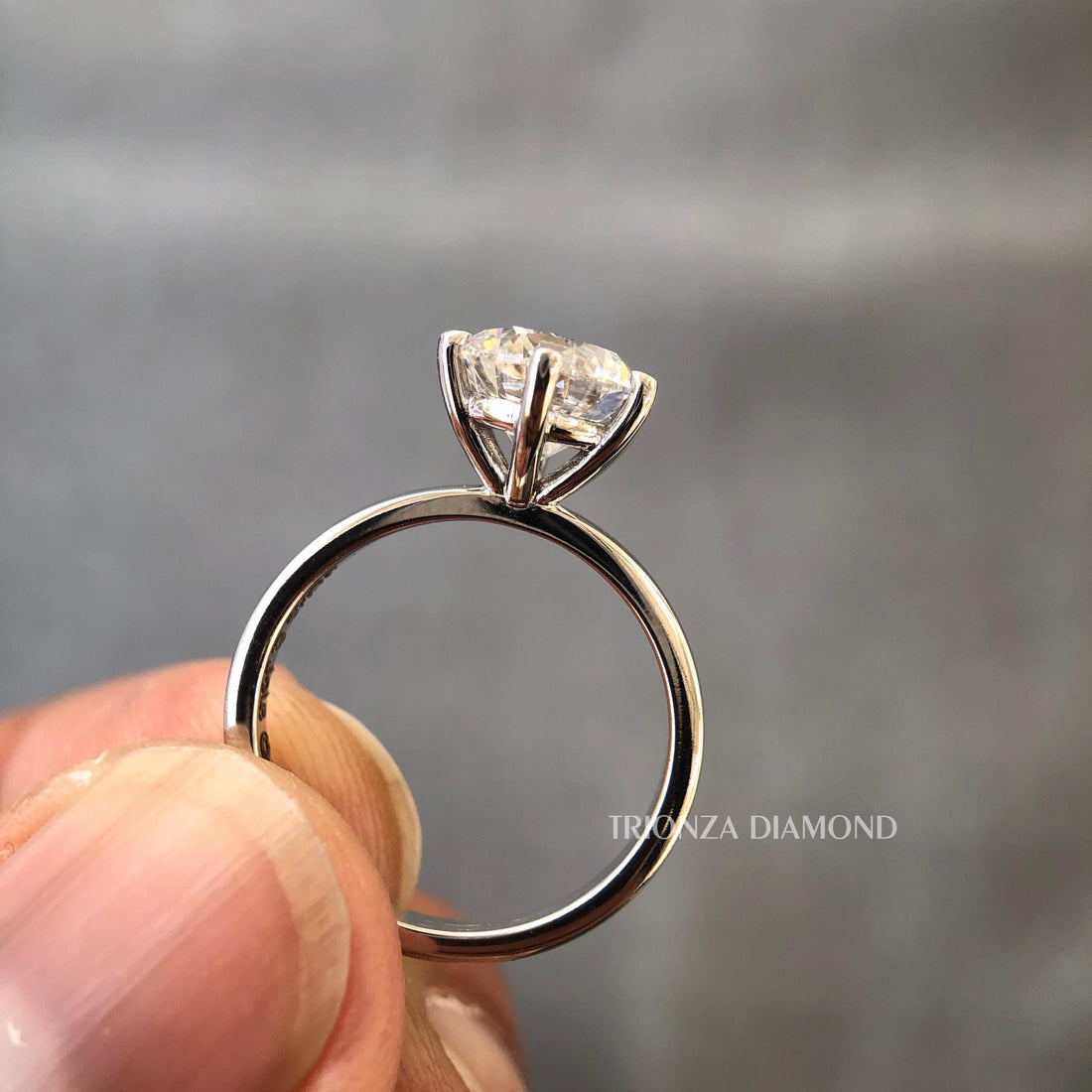 Round cut lab grown diamond solitaire ring featuring a 1.50 CT D color VVS2 center stone