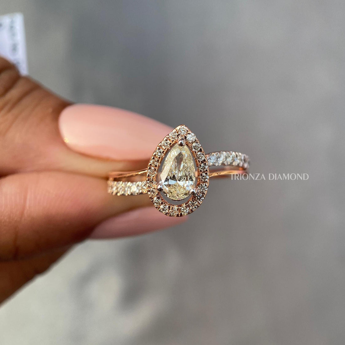 Intense yellow pear cut lab diamond ring crafted in 14k rose gold two tone design