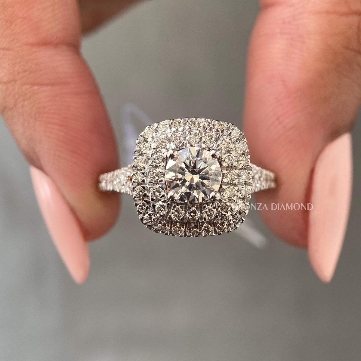 Round cut diamond ring with double cushion halo design shown in 14K solid gold
