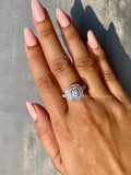 Woman wearing the round diamond halo ring, close-up view on her hand