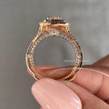 Close-up of the flower-inspired halo setting surrounding the D/VVS2 IGI certified diamond