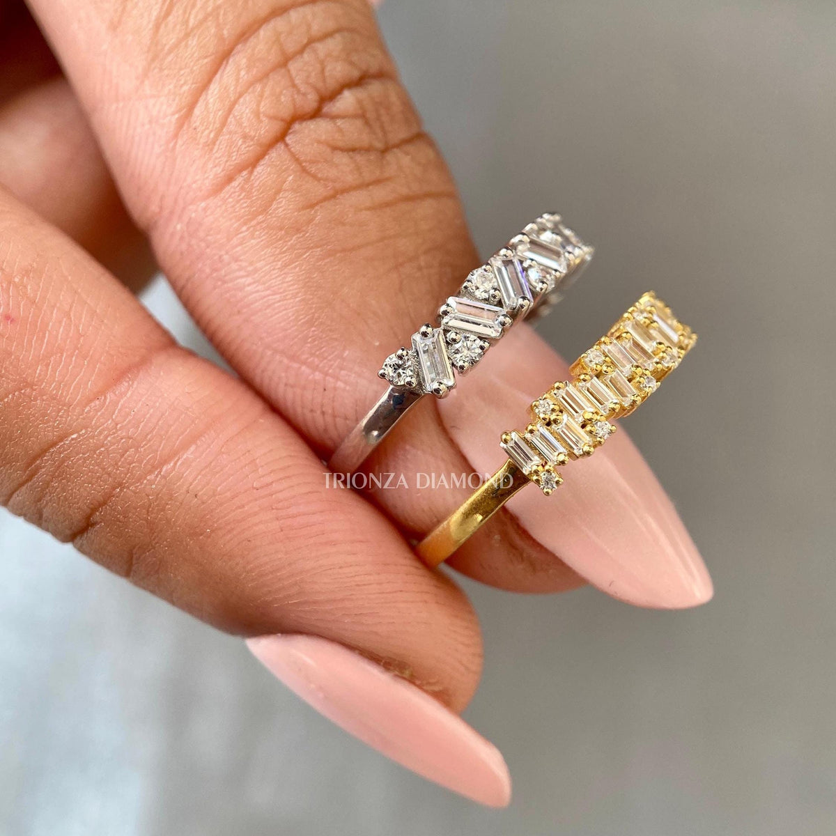 Close-up of the round and baguette cut lab grown diamonds set in a half eternity band