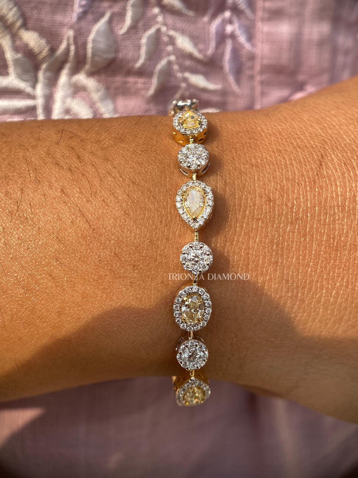TrionzaDiamond tennis bracelet handcrafted with pear, oval, and round cut lab grown diamonds