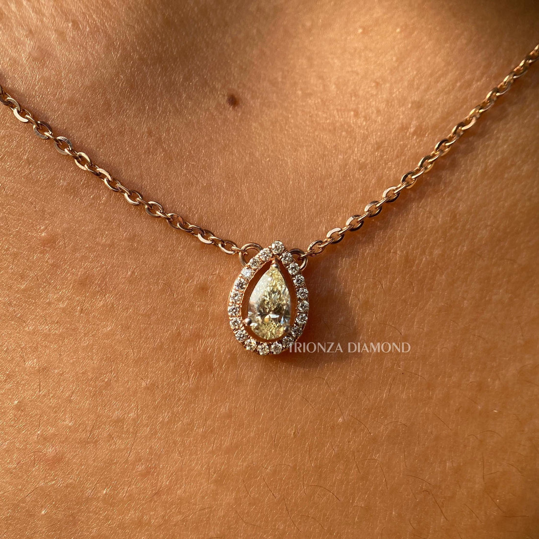 Pear cut lab grown diamond halo pendant crafted in 14K solid gold for elegant everyday wear