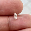 Loose marquise diamond shown from above highlighting its elongated cut and brilliant facets