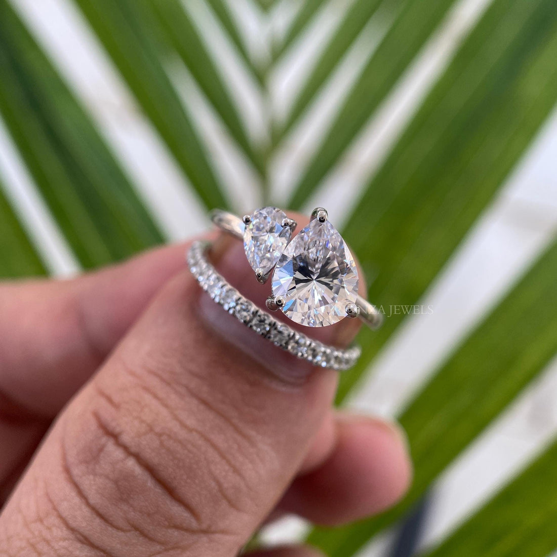 Toi Et Moi ring set featuring a 1.25 CT pear cut moissanite paired with a side pear stone
