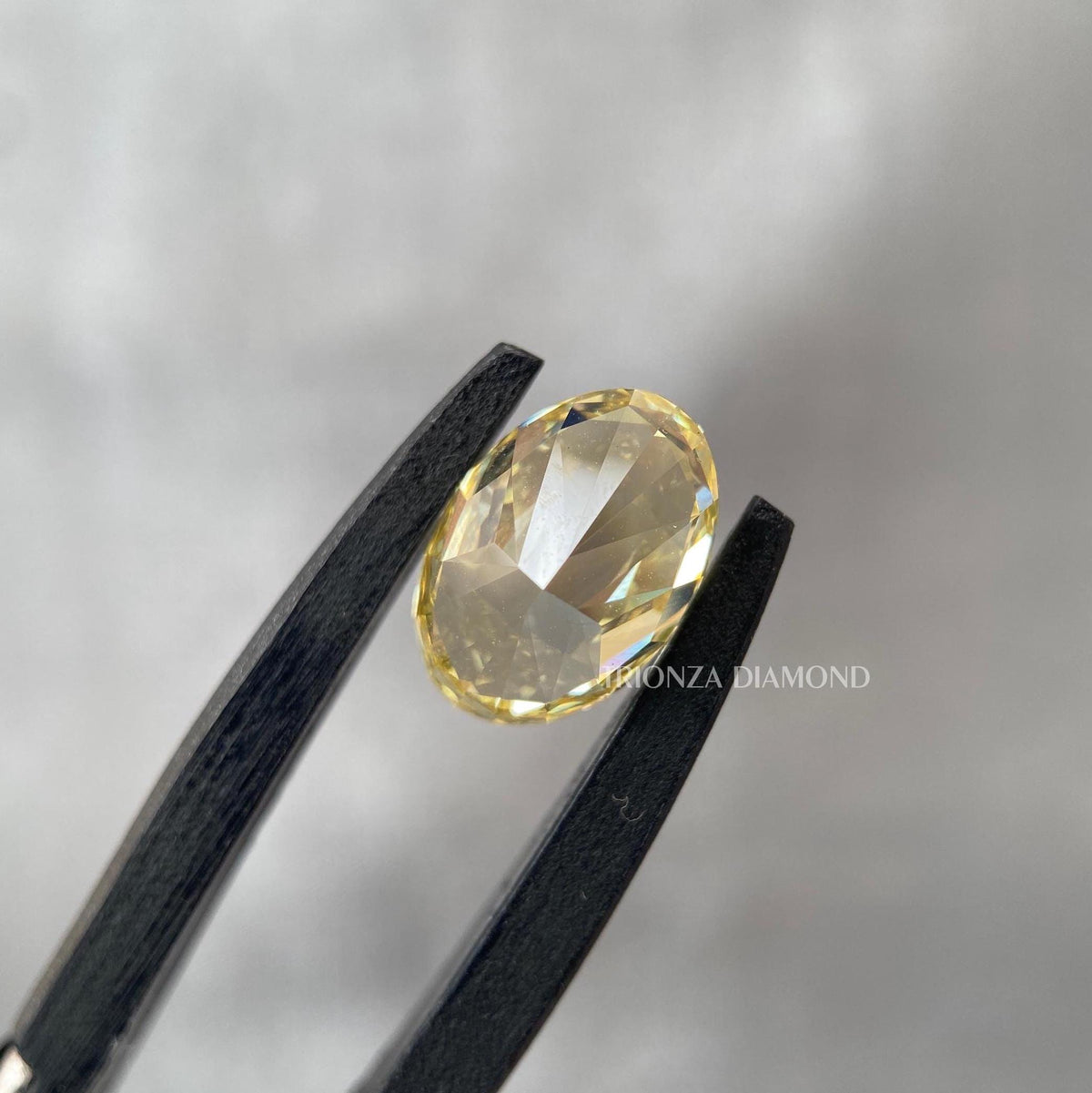 TrionzaDiamond engagement ring featuring an intense yellow oval diamond crafted for her