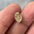 Oval cut yellow diamond engagement ring showcasing a Fancy Intense Yellow VS2 lab grown stone