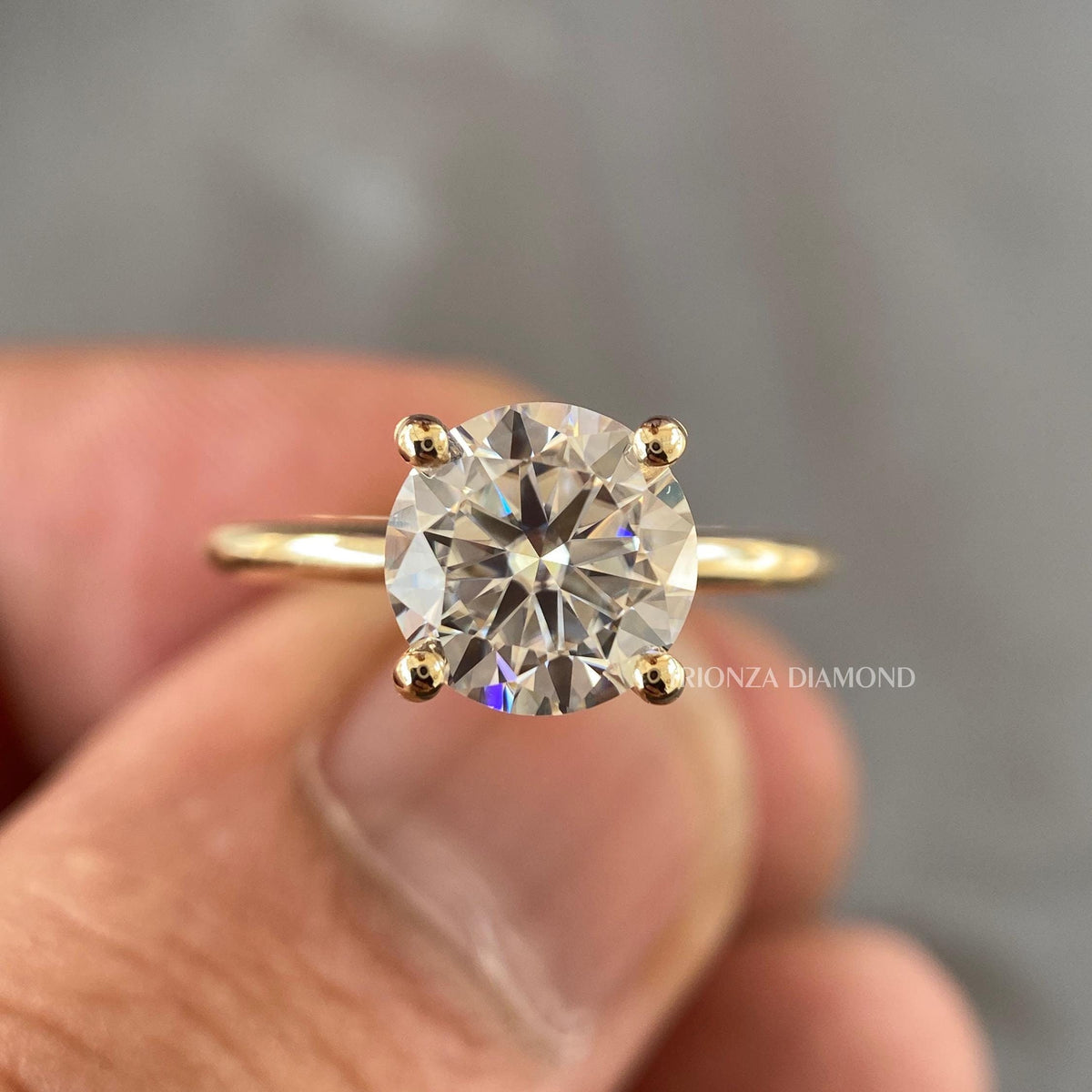 Round brilliant cut solitaire lab grown diamond ring crafted in 14K gold with a stackable band