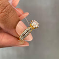 Pave set wedding ring designed for her featuring a 0.50 CT side stone accent