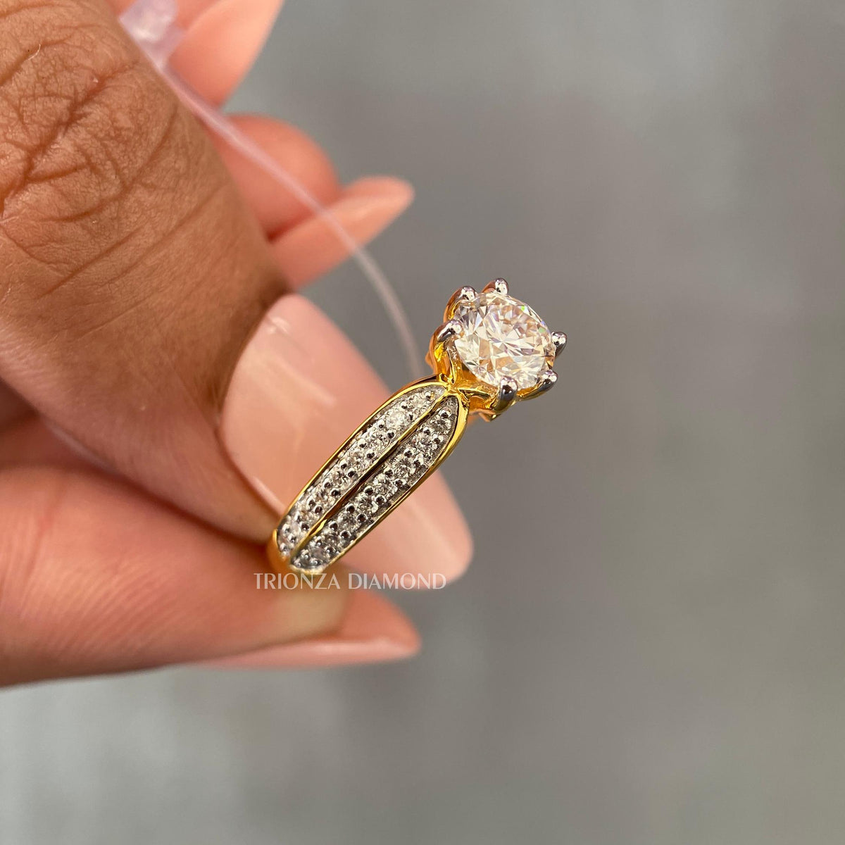 Pave set wedding ring designed for her featuring a 0.50 CT side stone accent
