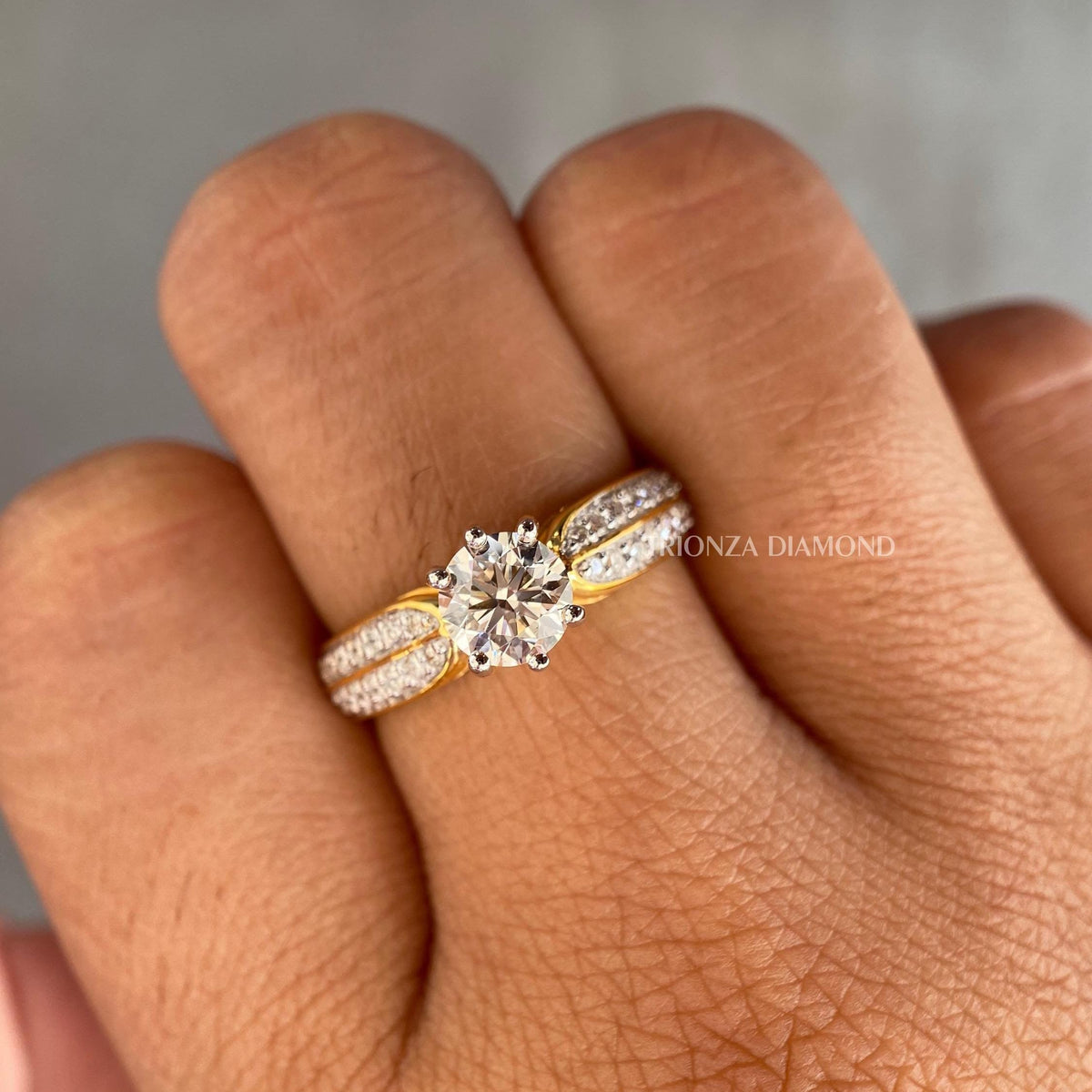Round cut lab grown diamond solitaire ring with pave set side stones in a classic setting