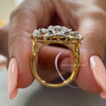 Side view of the diamond ring highlighting the baguette and round cut accent stones