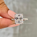 Radiant cut lab grown diamond engagement ring featuring a pave set band and round side stones