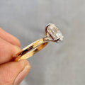 Woman wearing the oval solitaire diamond ring as an anniversary gift for her