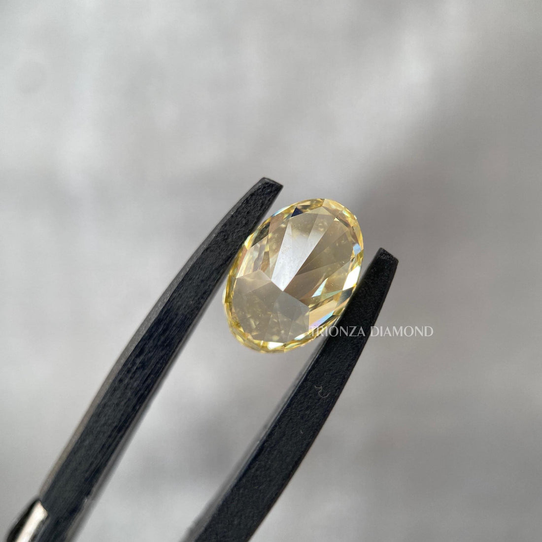 Oval cut vivid yellow lab grown diamond engagement ring crafted for a custom design