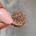 Woman wearing the rose gold marquise cluster diamond ring on her hand