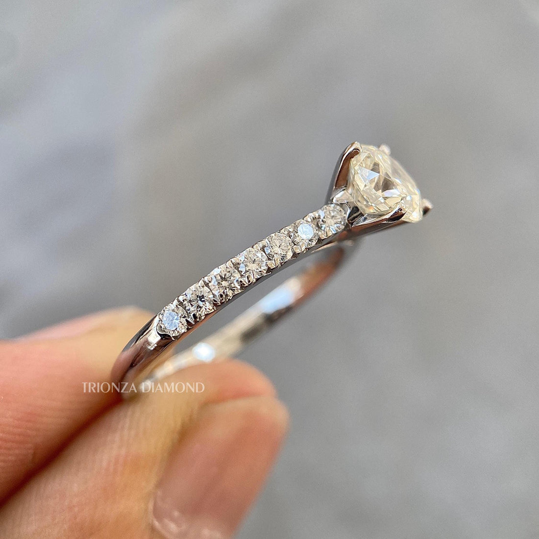 Round cut lab grown diamond ring featuring a classic pave setting for everyday elegance